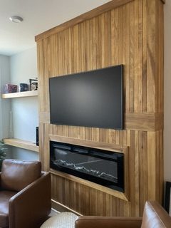 Custom wood accent wall with built-in electric fireplace, Raleigh NC